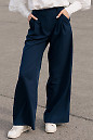 Штани палаццо синього кольору. Діловий жіночий одяг фото