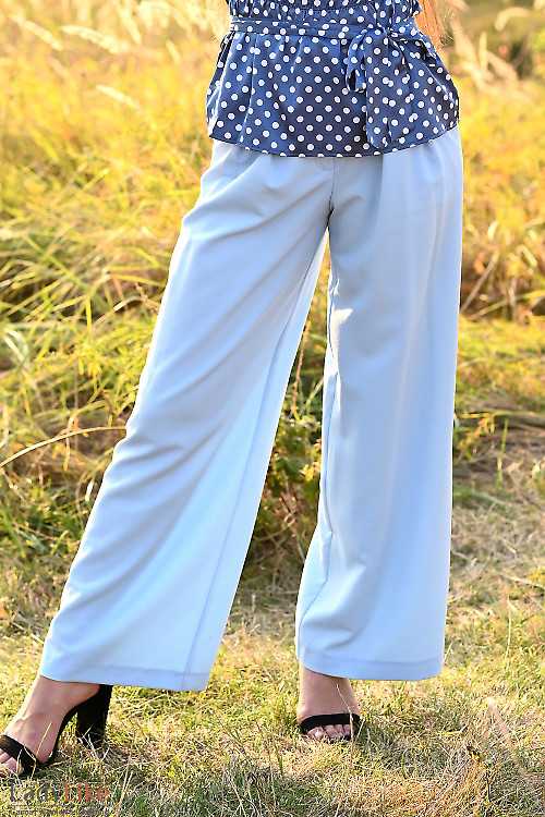 Женские брюки голубые палаццо. Деловая женская одежда фото