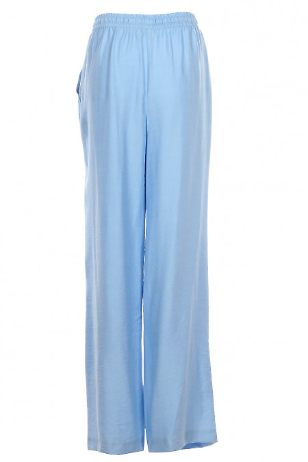 Штани широкі прямі блакитного  кольору. Діловий жіночий одяг фото