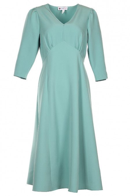 Сукня бірюзового кольору. Діловий жіночий одяг фото