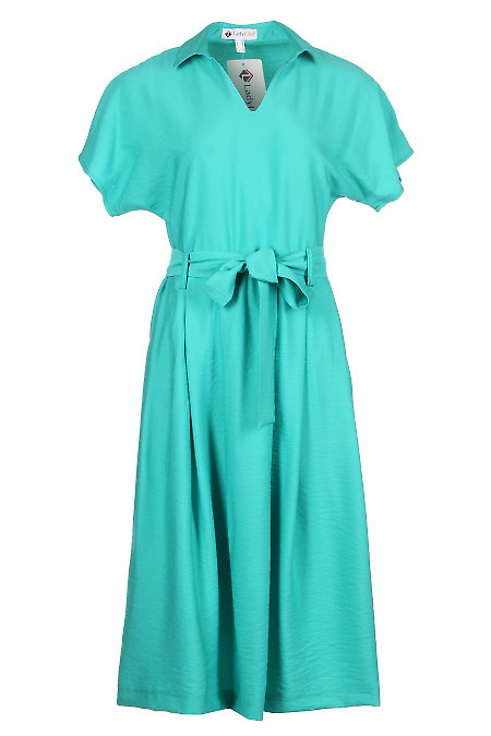 Сукня зеленого кольору. Діловий жіночий одяг фото