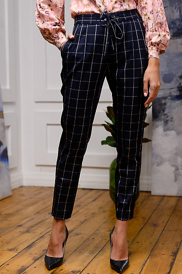 Брюки утеплені в білу клітинку. Діловий жіночий одяг