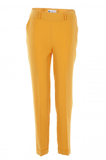 Брюки яскраво жовті з блискавкою збоку. Діловий жіночий одяг